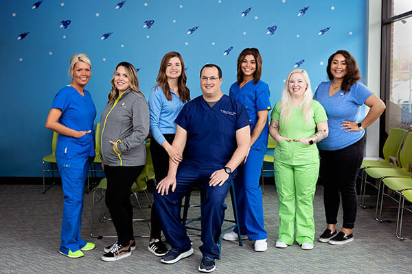 Pediatric Smiles staff poses together in the office